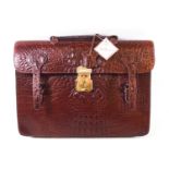 An early Mulberry attache case, in brown mock crocodile, with strap handle, a lock and two buckles,