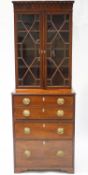 A 19th century bureau bookcase with gothic dentilled cornice over two astragal glazed doors,