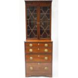 A 19th century bureau bookcase with gothic dentilled cornice over two astragal glazed doors,