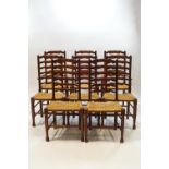 A set of eight George II style oak and ash ladder back chairs,