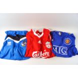 Seven replica football shirts