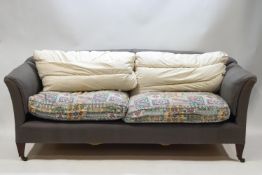 A Howard & Sons sofa on square tapering legs,