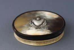 A Scottish horn snuff box with embossed silver thistle to lid.