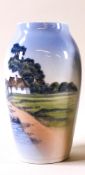 A Royal Copenhagen vase, decorated with a cottage upon the shoreline,