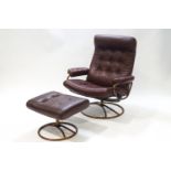 An Ekornes stressless leather reclining chair and matching stool