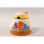 A Clarice Cliff Newport Pottery Spring Crocus pattern 'beehive' preserve pot and cover, 9.