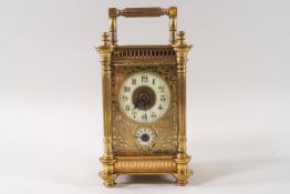 An Edwardian carriage clock with alarm dial,