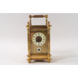 An Edwardian carriage clock with alarm dial,