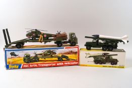 A Dinky Honest John missile launcher, No 665 and an AEC Artic transporter with helicopter No 618,