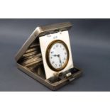 An engine turned silver travelling/bedside clock of rectangular form Birmingham 1928.