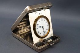 An engine turned silver travelling/bedside clock of rectangular form Birmingham 1928.