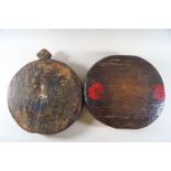 An Indian circular wooden spice grinding stool, painted with a lady in traditional dress,