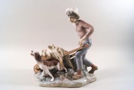 A Lladro porcelain figure of a boy collecting hay with his dog,