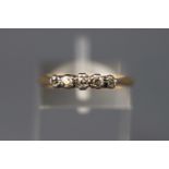 A yellow and white metal five stone diamond ring, stamped 18ct Plat,