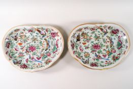 A pair of Celadon plates, of shaped form richly enamelled with birds, butterflies and flowers,