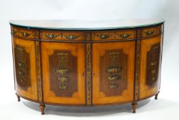 A George III mahogany and satinwood bow fronted commode,
