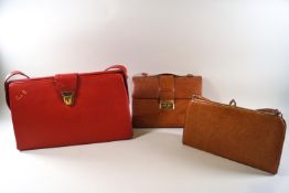 A vintage red leatherette handbag, embossed 'C de B', 39cm high (inc strap) x 39cm wide,