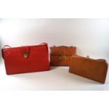 A vintage red leatherette handbag, embossed 'C de B', 39cm high (inc strap) x 39cm wide,