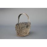 A white metal filigree basket 11.