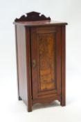 A Victorian mahogany pot cupboard, with raised back and panelled door, 85cm high, 39cm wide,