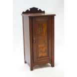 A Victorian mahogany pot cupboard, with raised back and panelled door, 85cm high, 39cm wide,