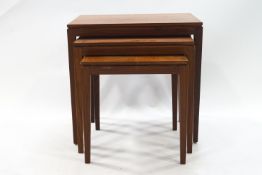 A 20th century mahogany nest of three tables,