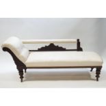 A Victorian mahogany chaise longue with button back cream upholstery,