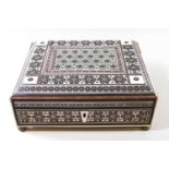 A 19th century Vizagapatam ivory inlaid box on brass feet.