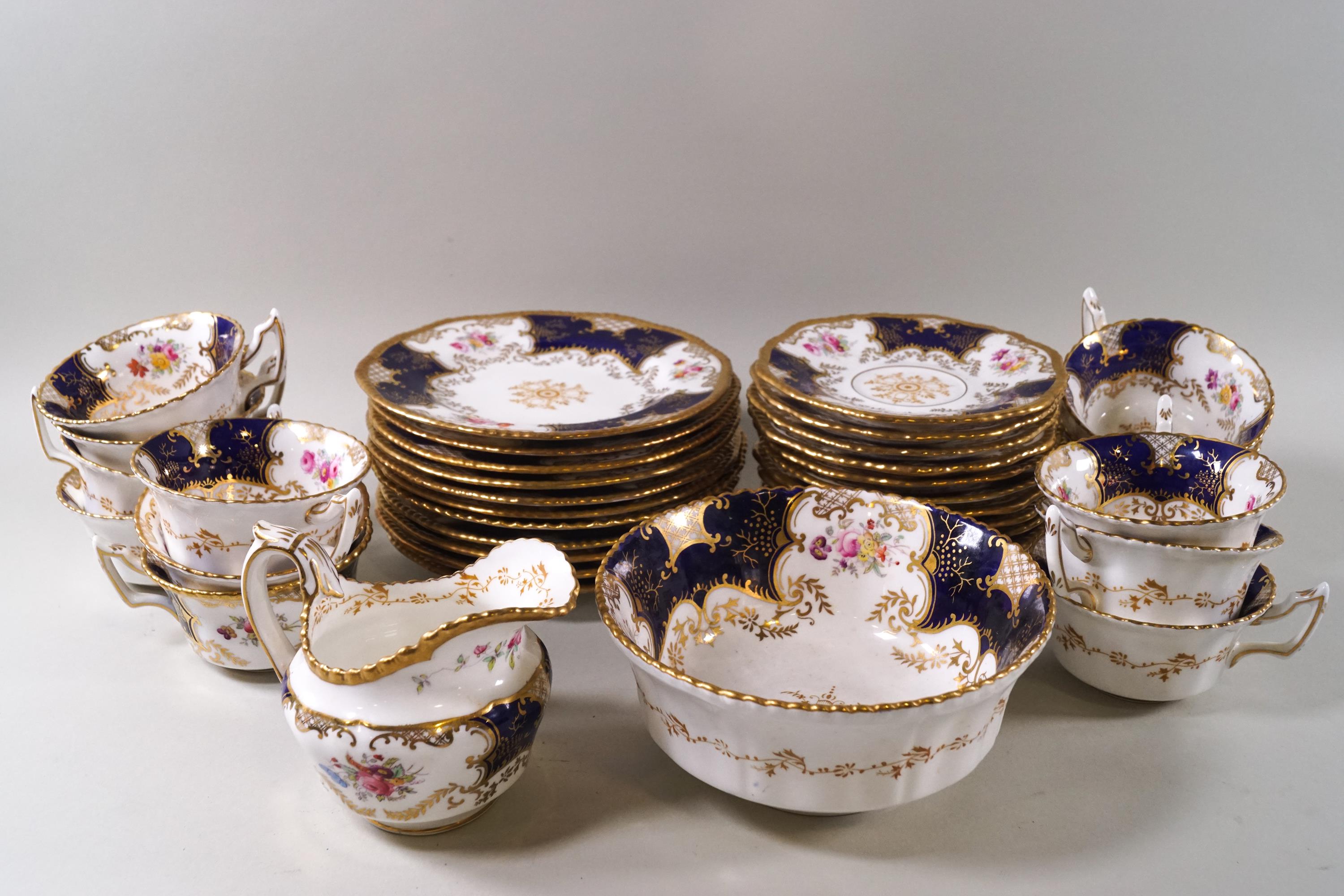 A Coalport porcelain part tea set, decorated with flower sprigs,