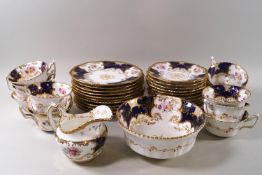 A Coalport porcelain part tea set, decorated with flower sprigs,