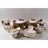 A Coalport porcelain part tea set, decorated with flower sprigs,
