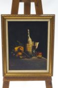 M Morgan, Still Life of a bottle of wine with cheese and fruit, oil on canvas, signed lower right,