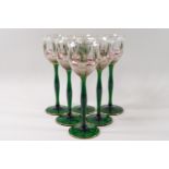 A set of six Art Nouveau Theresienthal enamelled and acid etched hock glasses each with a green