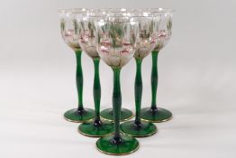 A set of six Art Nouveau Theresienthal enamelled and acid etched hock glasses each with a green