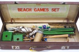 A Jacques beach game set in original simulated leather case,