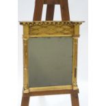 A 19th century giltwood wall mirror with ball decoration to the frieze and pilasters to either side,