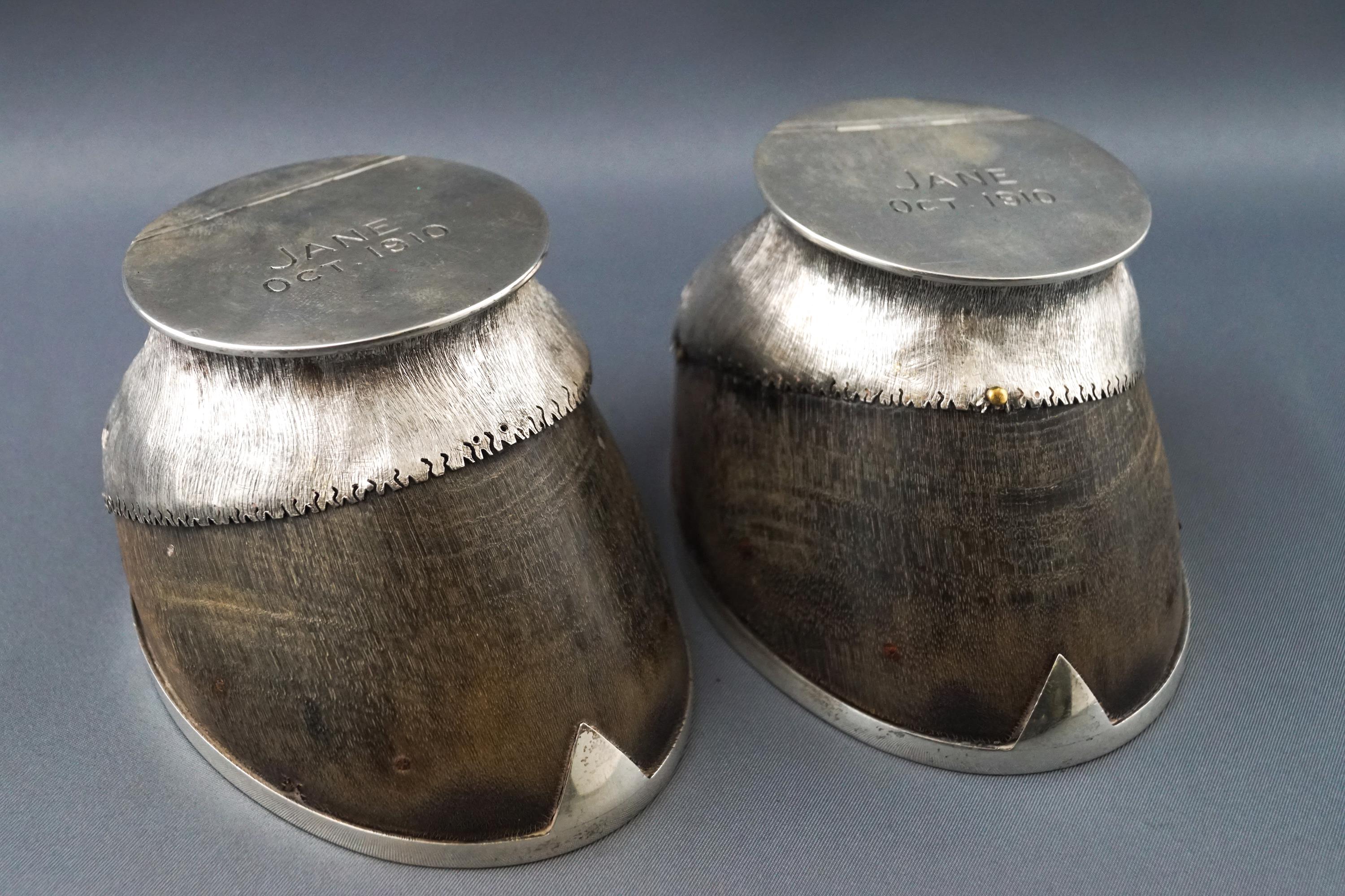 A pair of silver mounted donkey hoof inkwells, the lids engraved "Jane Oct 1910", London, 1910,