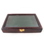 A small wooden medal case,