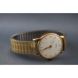 A 9ct gold Vertex wristwatch with silver dial having mixed markings. Manual wind movement.
