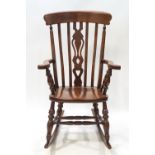 A country stick back rocking chair