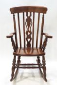 A country stick back rocking chair