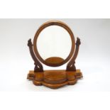 A Victorian mahogany oval swing frame mirror,