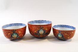 A set of three Chinese graduated tea bowls, decorated in the Imari palette, the largest 9.