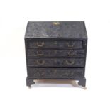 A 19th century bureau with carved fall front above three graduated drawers on bracket feet,