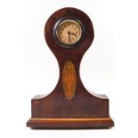 An Edwardian mahogany balloon clock with round Arabic dial,