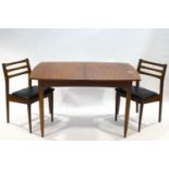 A 1970's White & Newton extending dining table, the top with hidden folding leaf,
