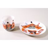A Japanese porcelain saki cup and saucer, painted with warriors, six character marks,