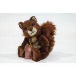 A Charlie Bear squirrel, 'Colonel McNutty', 32 cm high, with tags, limited edition No 1222 of 2000,