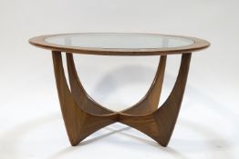 A G-Plan circular coffee table with glass inset top,