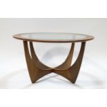 A G-Plan circular coffee table with glass inset top,